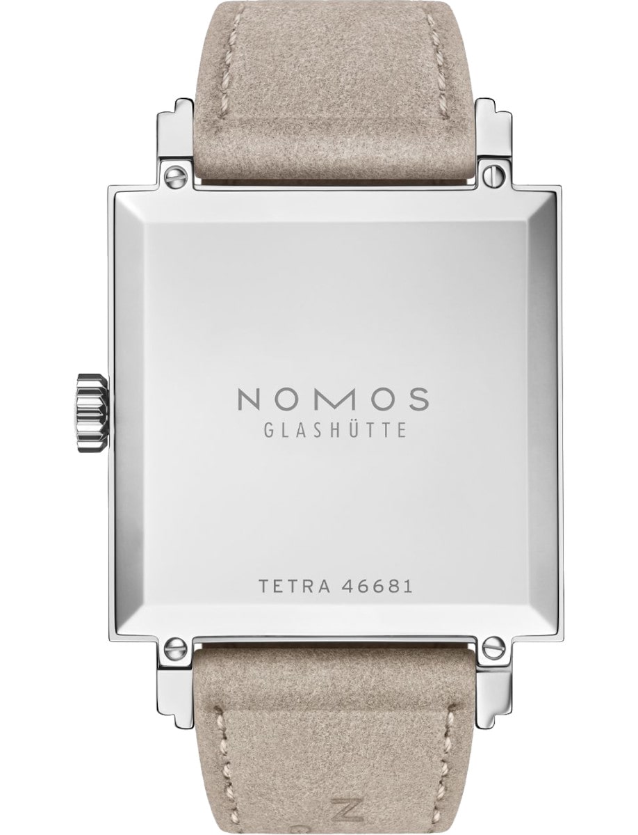 Back view of Nomos wristwatch with stainless steel case, and vegan velour remborde beige strap.