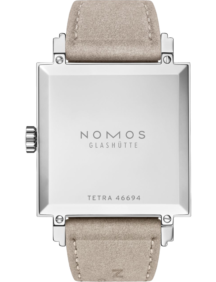 Back view of Nomos wristwatch with stainless steel case, and vegan velour remborde beige strap.
