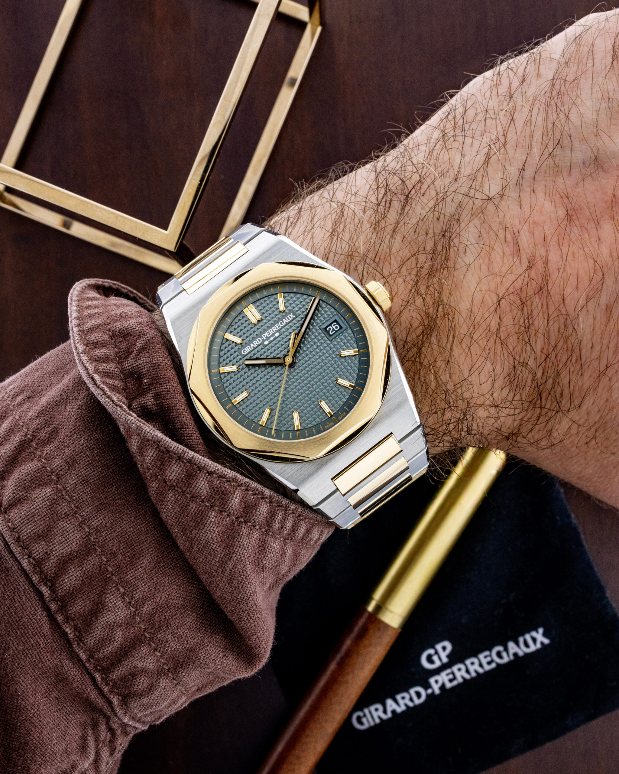 Hotlist image for Girard-Perregaux wristwatch with 3N Yellow gold and steel case and bracelet, and sunray grey dial.