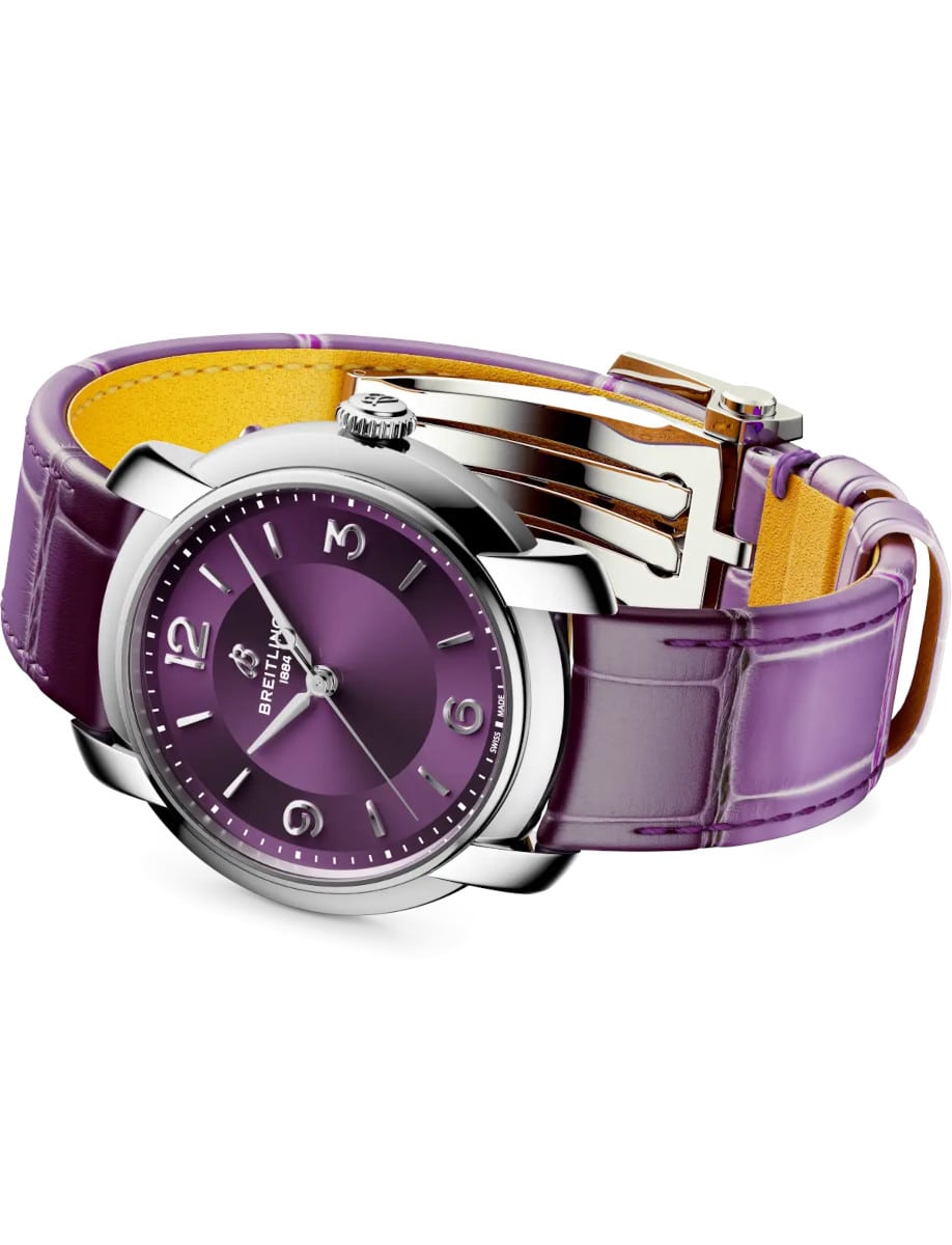 Side view of Breitling wristwatch with stainless steel case, purple dial, and purple alligator leather.