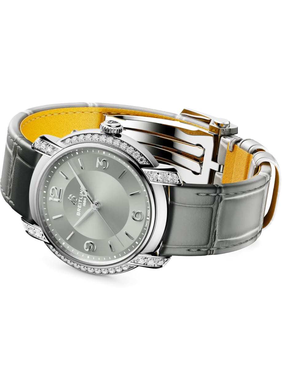 Side view of Breitling wristwatch with stainless steel case with diamonds, grey dial, and grey alligator leather.