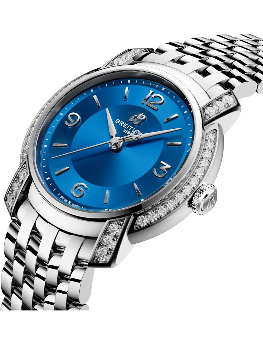 Side view of Breitling ladies watch with stainless steel case and bracelet, and blue mother-of-pearl dial.