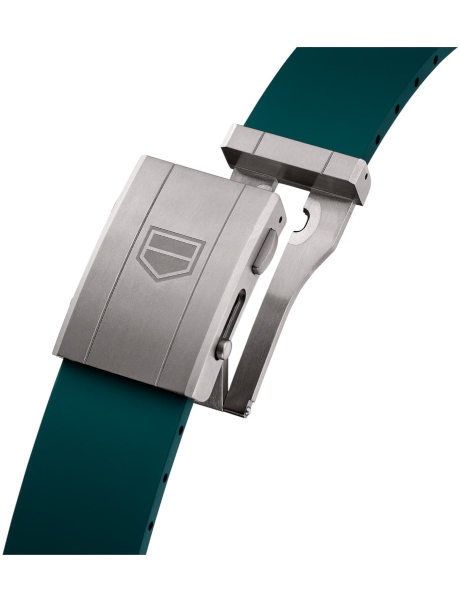 Titanium buckle of Tag Heuer wristwatch green rubber strap.