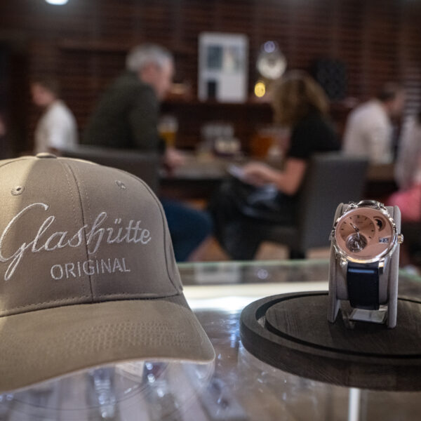 A hat and watch from Glashutte Original on the counter at Feldmar's World Watch Day event