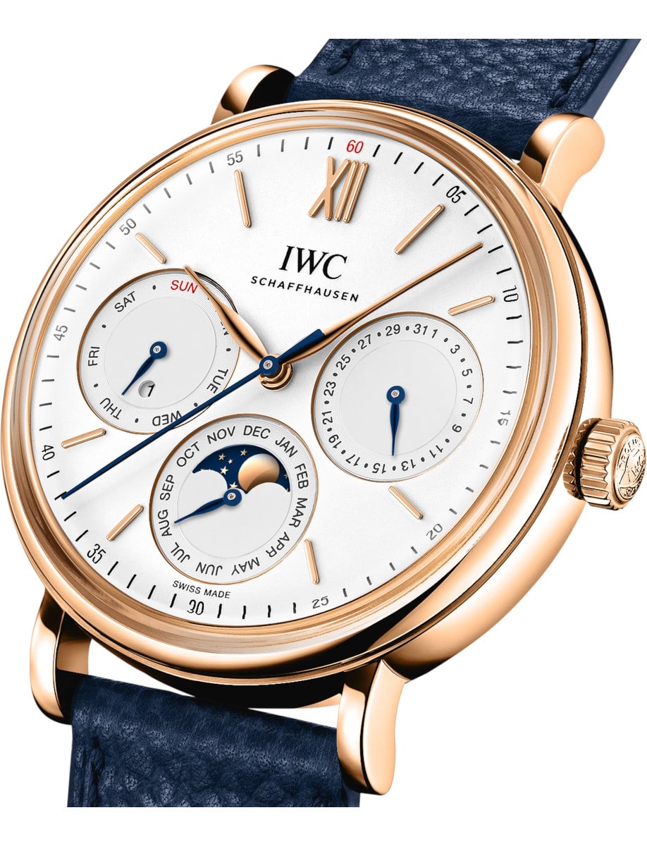 Side view of IWC wristwatch with 18k 5N Gold case, silver-plated dial, and blue calfskin strap.