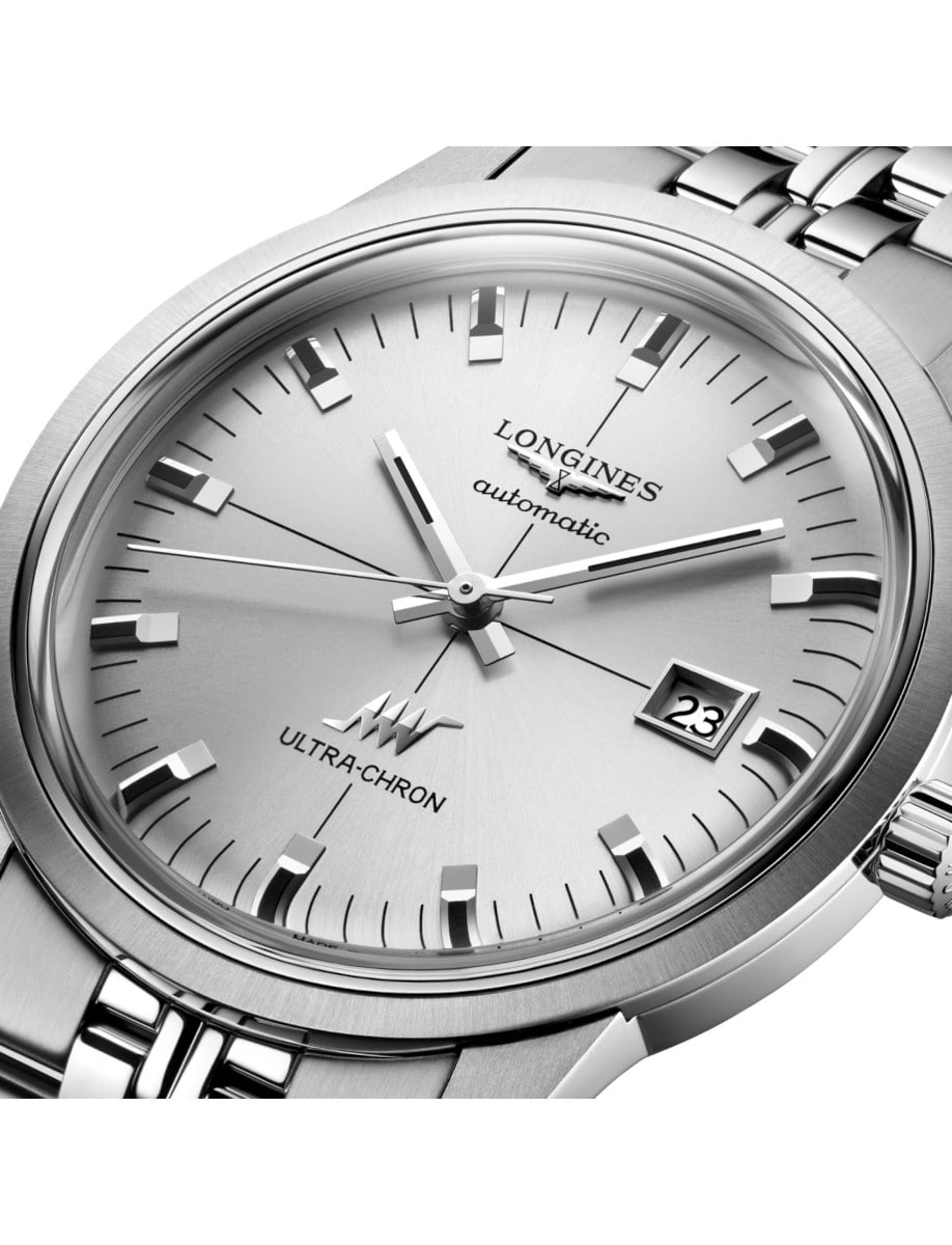 Close view of Longines wristwatch with stainless steel case and bracelet, and sunray silver dial.