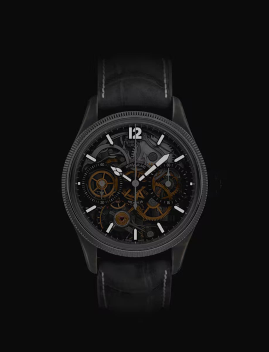 Montblanc wristwatch with stainless steel case and 18k white gold bezel, dial with luminous hands and indexes, and black nubuck alligator strap.