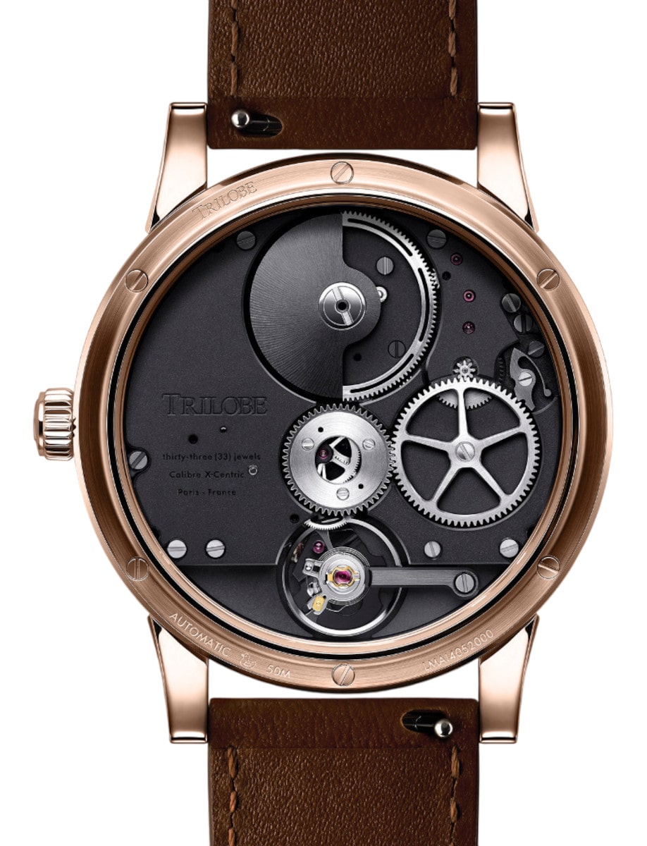 Back view of Trilobe wristwatch with rose gold case, chocolate alligator strap, and transparent case back.