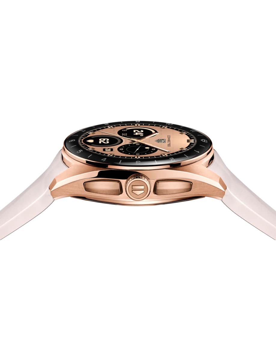 Side view of Tag Heuer wristwatch with Rose Golden PVD Steel case, OLED display, and pink rubber strap.