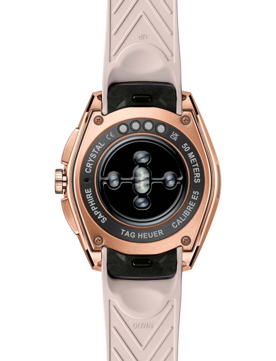 Back view of Tag Heuer wristwatch with Rose Golden PVD Steel case, and pink rubber strap.