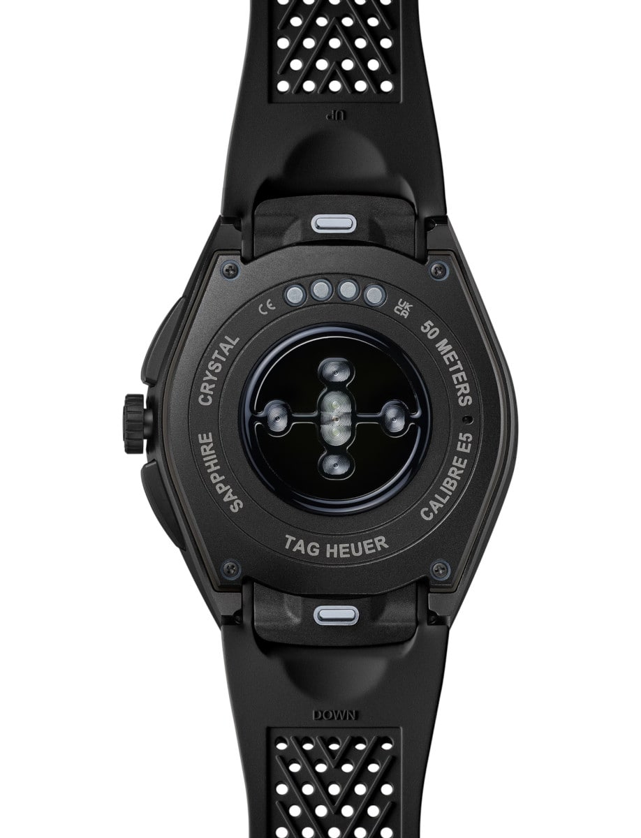 Back view of Tag Heuer wristwatch with black DLC Grade 2 Titanium case, and black rubber strap.