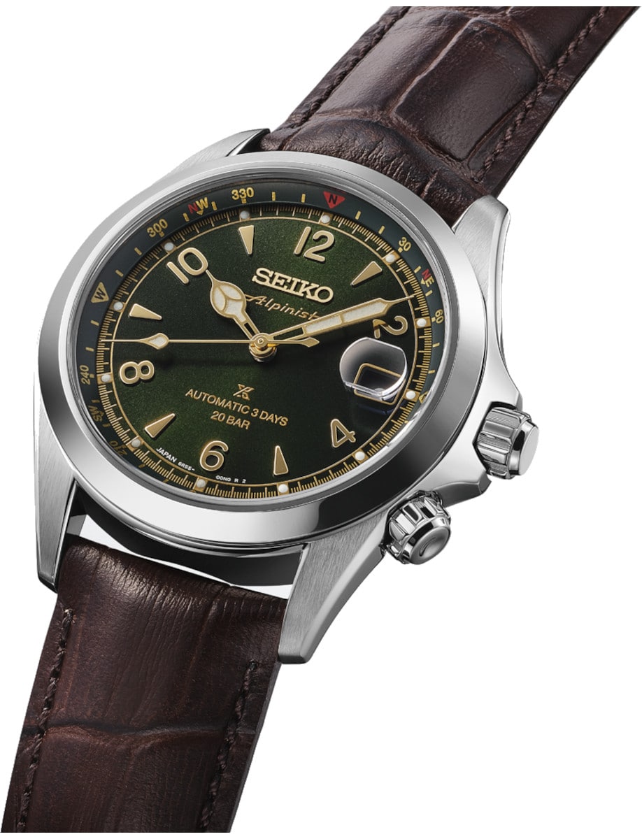 Side view of Seiko wristwatch with stainless steel case, green dial, and cow leather strap.