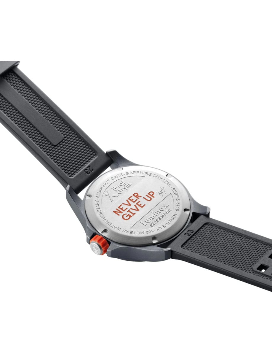 Back view of Luminox wristwatch with aluminium case, and grey rubber strap.