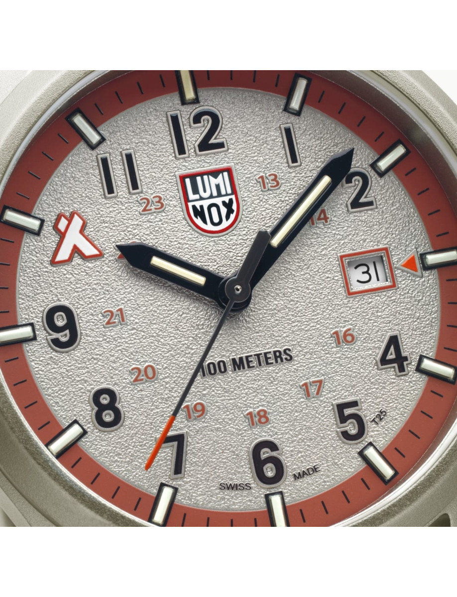 Close view of Luminox wristwatch with aluminium case, and sand colored dial.