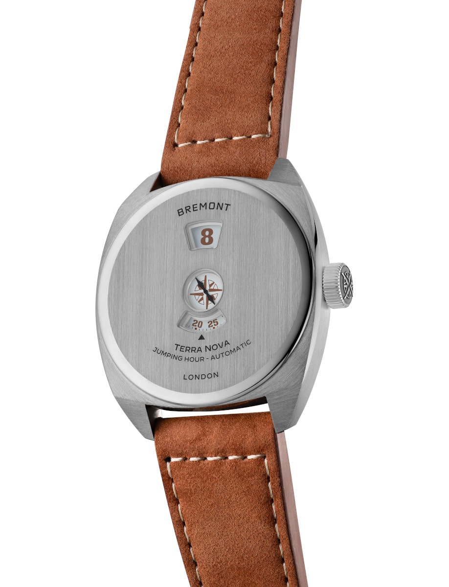 Side view of Bremont wristwatch with stainless steel case and dial, and brown leather strap.
