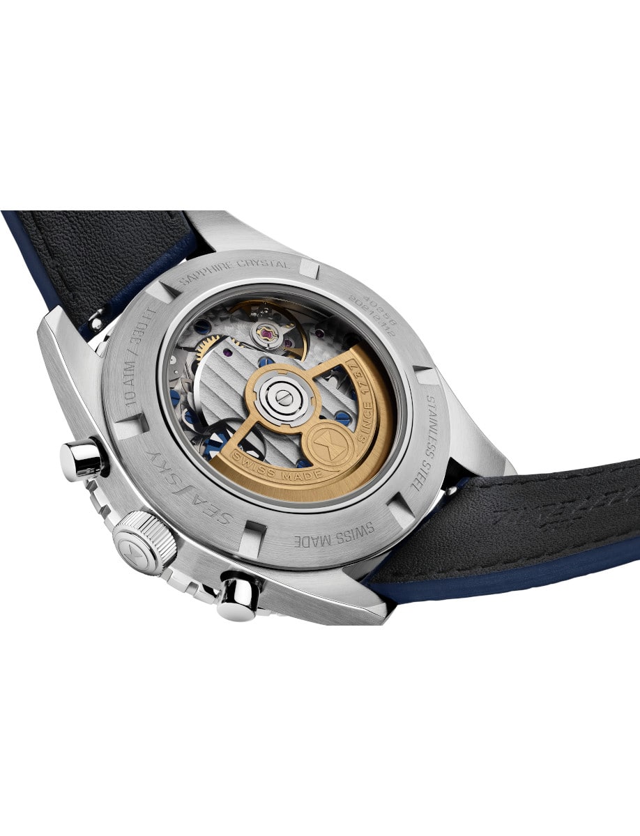 Back view of Favre Leuba wristwatch with stainless steel case, open case back, and blue leather strap.