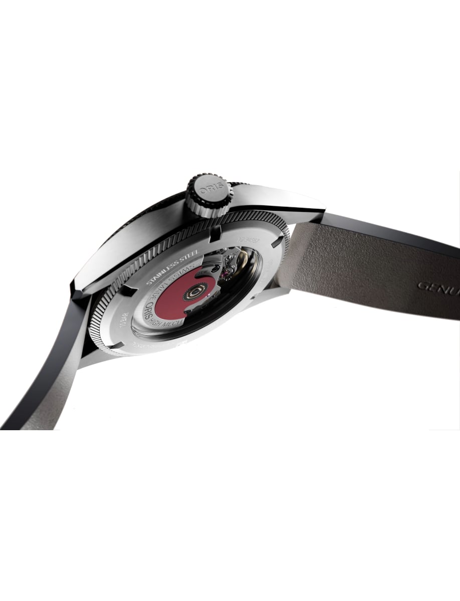 Back view of Oris wristwatch with stainless steel case, open case back, and beige suede leather strap.