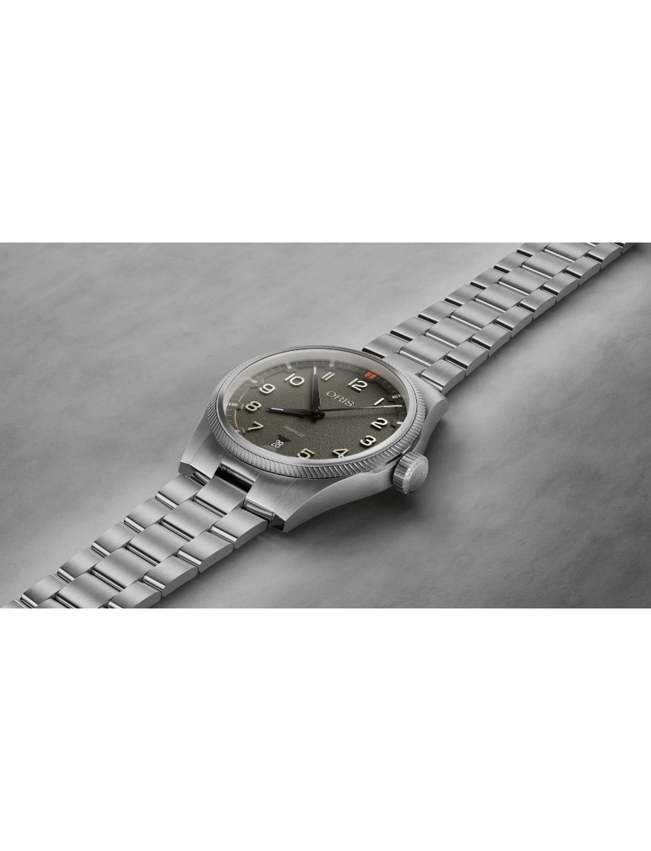 Side view of Oris wristwatch with stainless steel case and bracelet, and moss green dial.