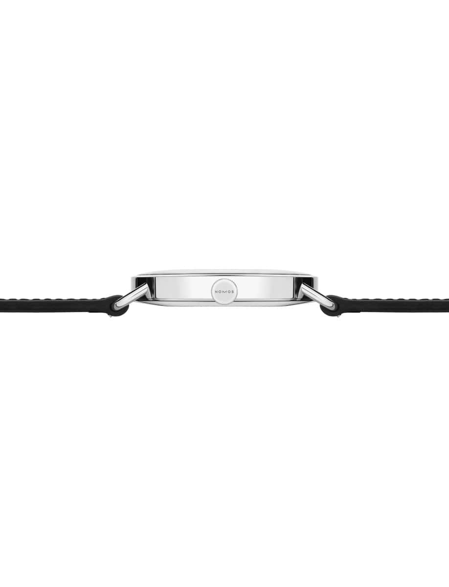 Side view of Nomos wristwatch with stainless steel case, and black Horween Genuine Shell Cordovan strap.