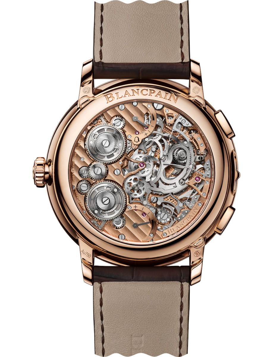 Back view of Blancpain wristwatch with red gold case, open caseback, and alligator leather.