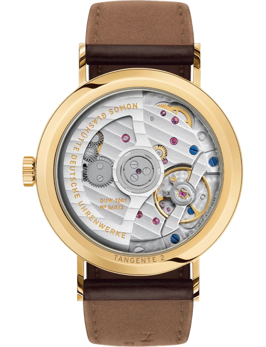 Back view of Nomos wristwatch with gold 18k 3N case, open case back, and brown Horween Genuine Shell Cordovan.