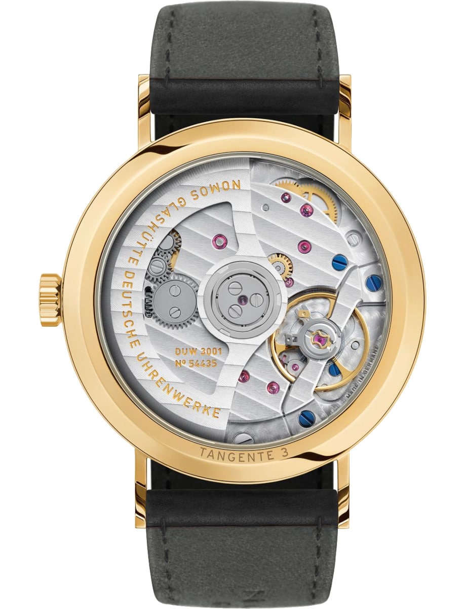 Nomos wristwatch with gold 18k 3N case, ope case back, and black Horween Genuine Shell Cordovan.