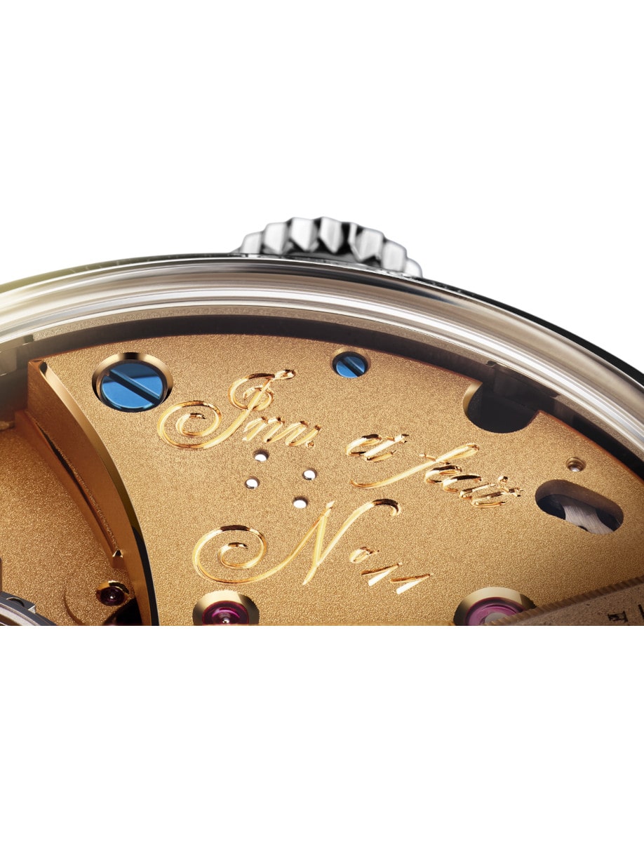 Close view of Arnold&Son wristwatch with platinum case, and 18k yellow gold dial.