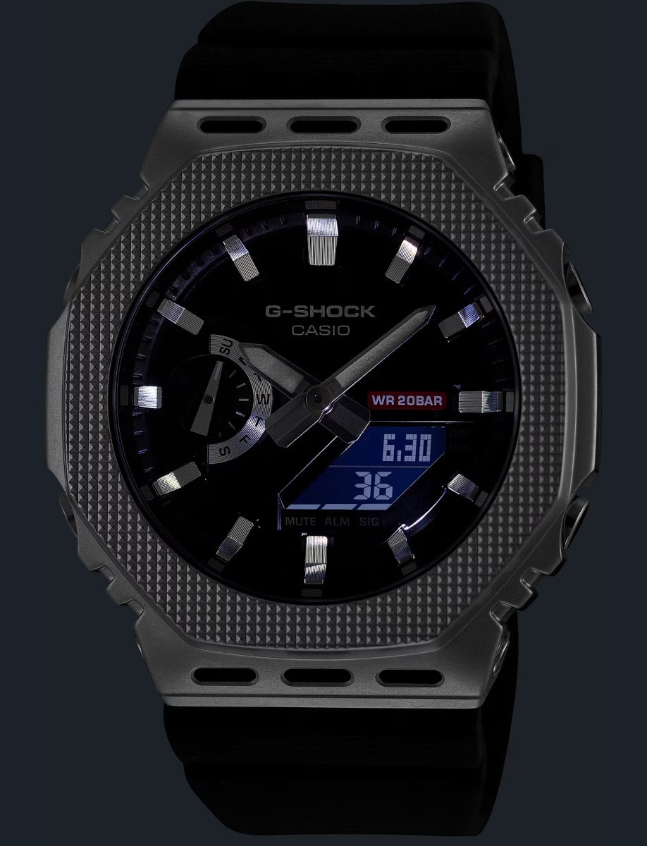 Night view of G-Shock wristwatch with resin / stainless steel case, bio-based resin band, and black dial.