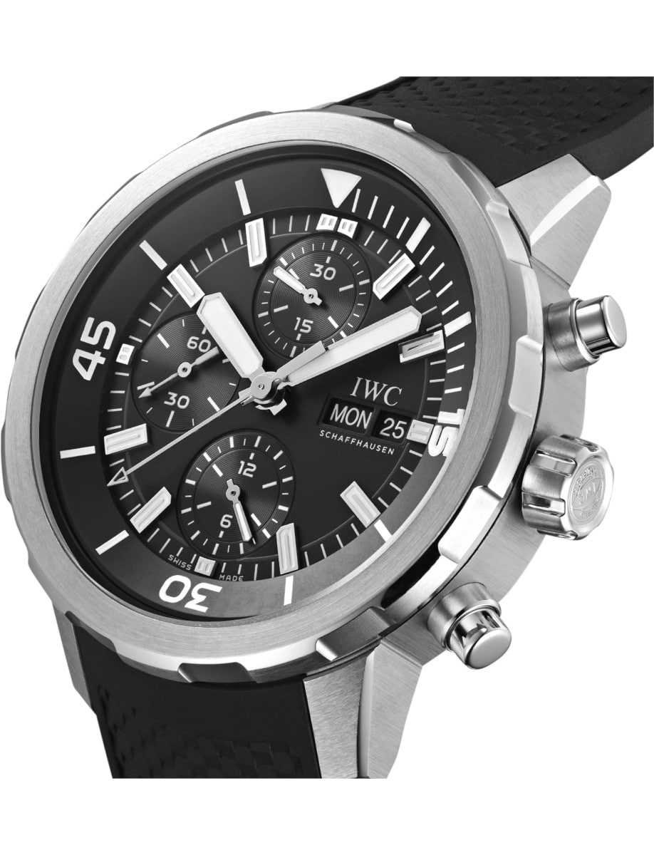 Side view of IWC wristwatch with stainless steel case, black dial and black rubber strap.