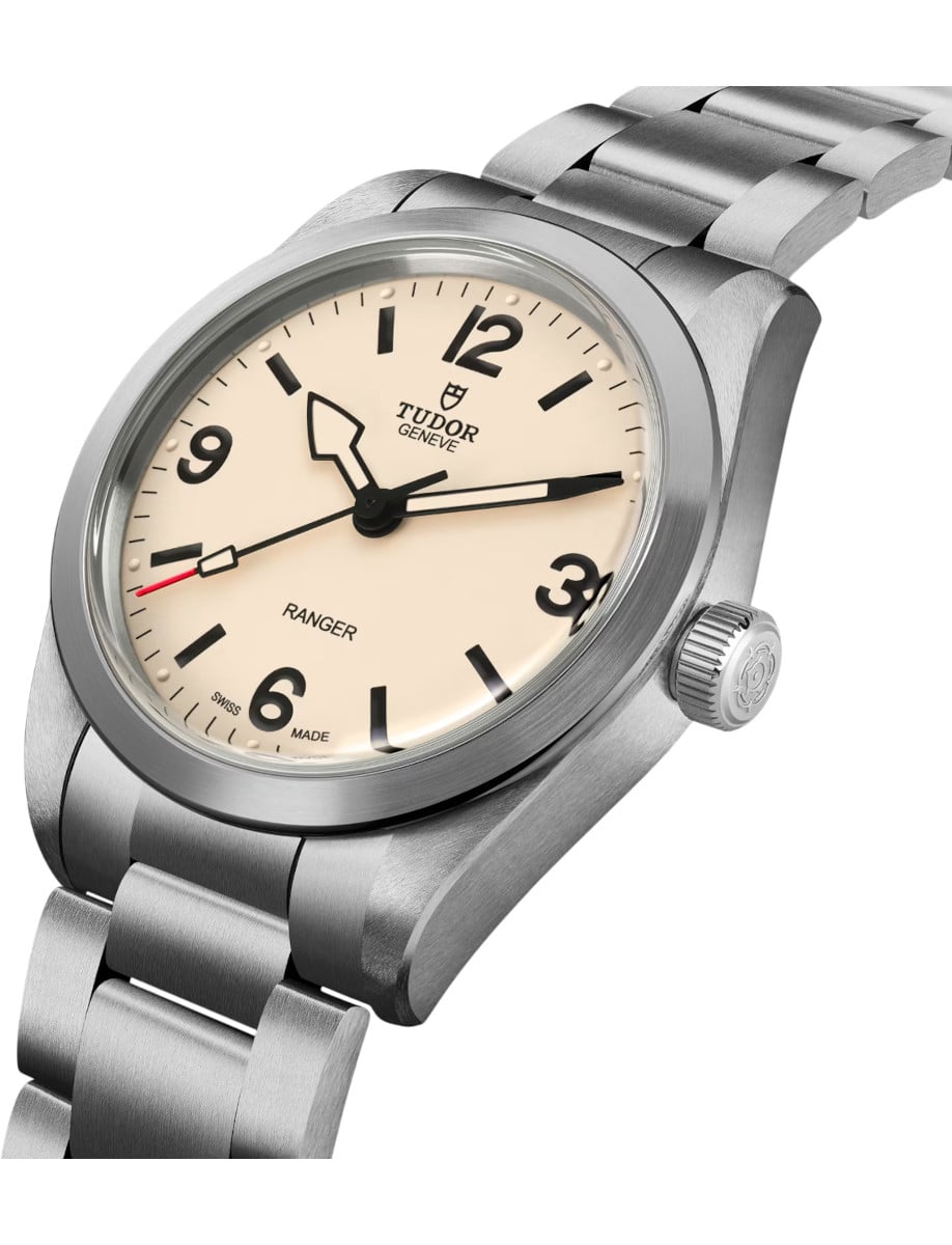Side view of Tudor wristwatch with stainless steel case and bracelet, beige dial.