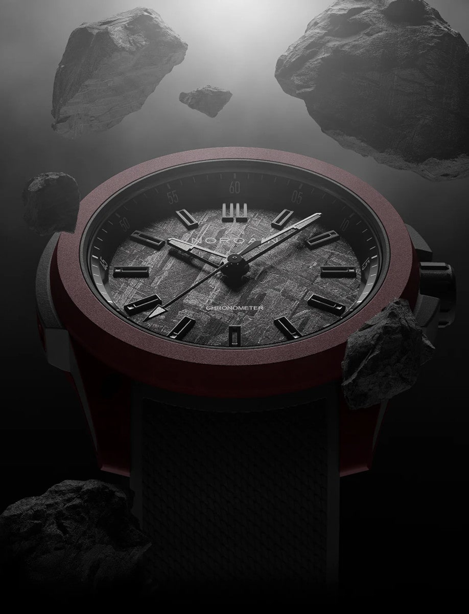 Side view of Norqain wristwatch with sandblasted titanium case, anthracite iron meteorite dial, and Integrated anthracite rubber strap.