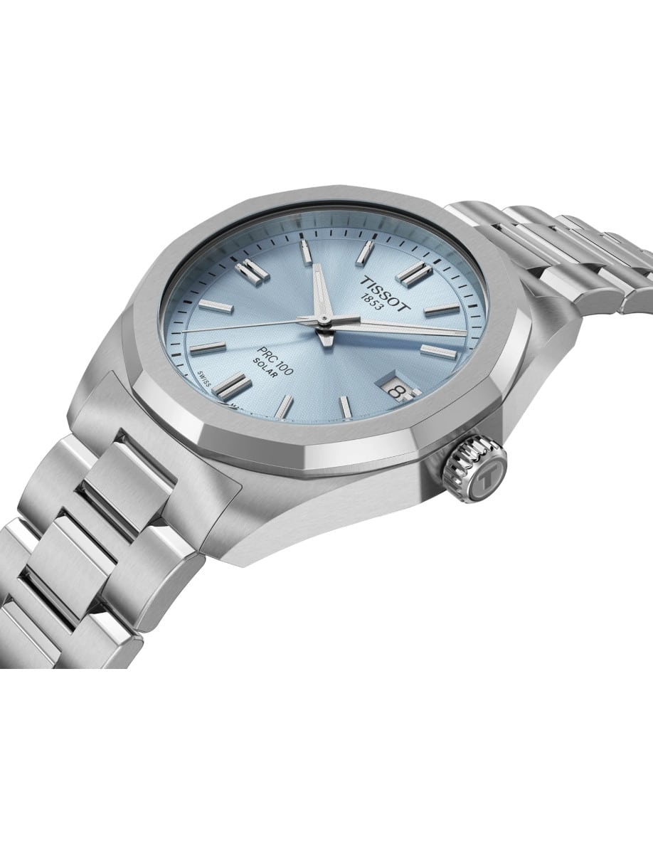 Side view of Tissot wristwatch with stainless steel case and bracelet, and ice blue dial.