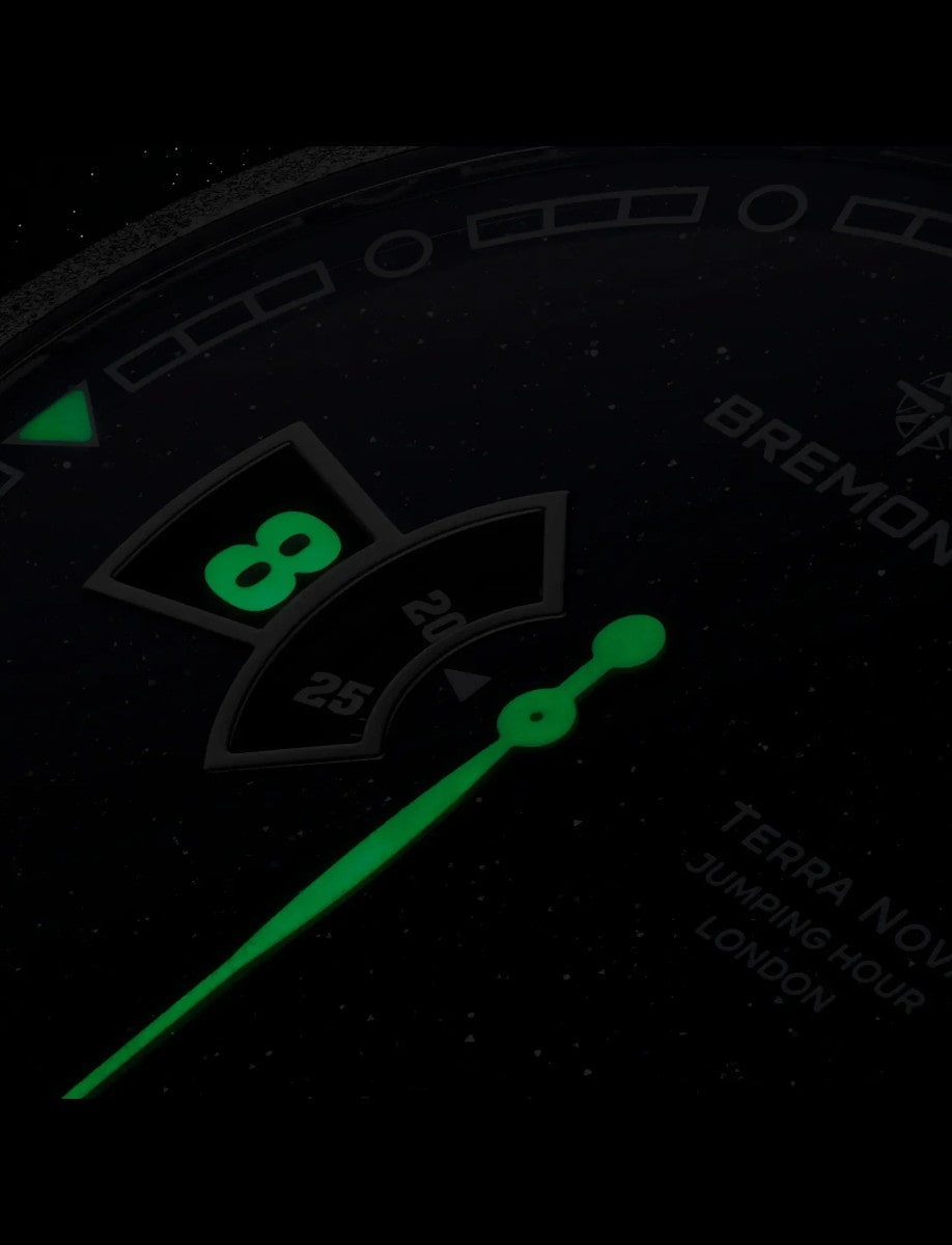 Night view of Bremont wristwatch with luminous hands and hour markers.