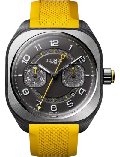 Hermes wristwatch with carbon fiber composite case, black gold treated and blackened dial, and Naples yellow rubber strap.