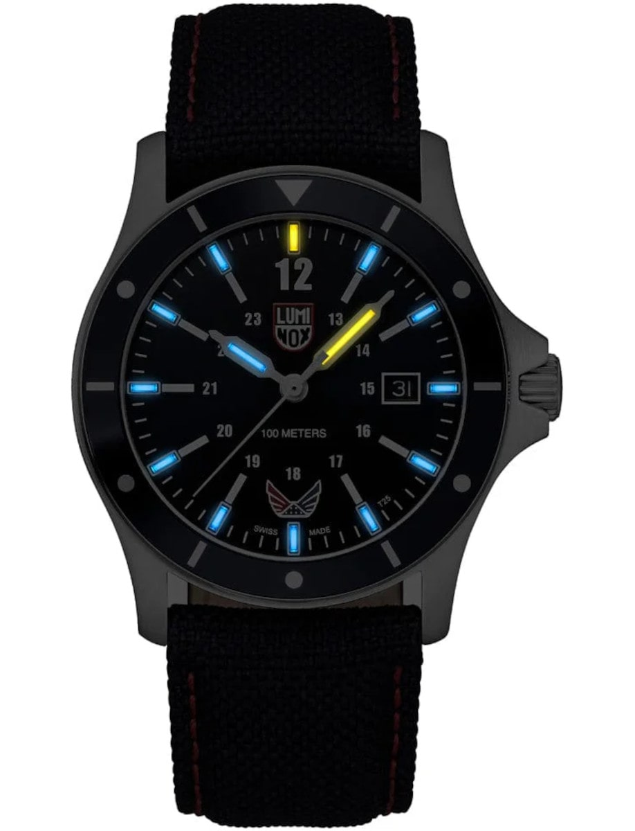 Luminox wristwatch with stainless steel case, deep blue sunray dial with Luminox Light Technology, navy blue textile strap with red stitching detail.