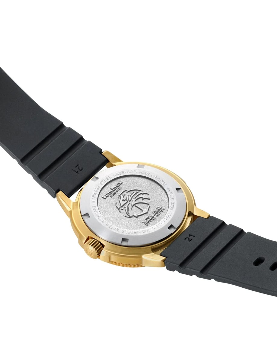 Back view of Luminox wristwatch with gold stainless steel case, black dial and black rubber strap