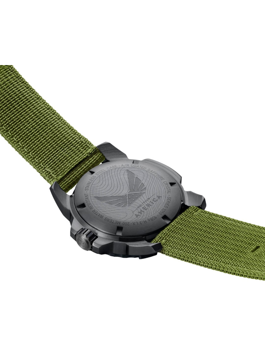 Back view of Luminox wristwatch with IP black stainless steel case, black dial, and green textile strap.