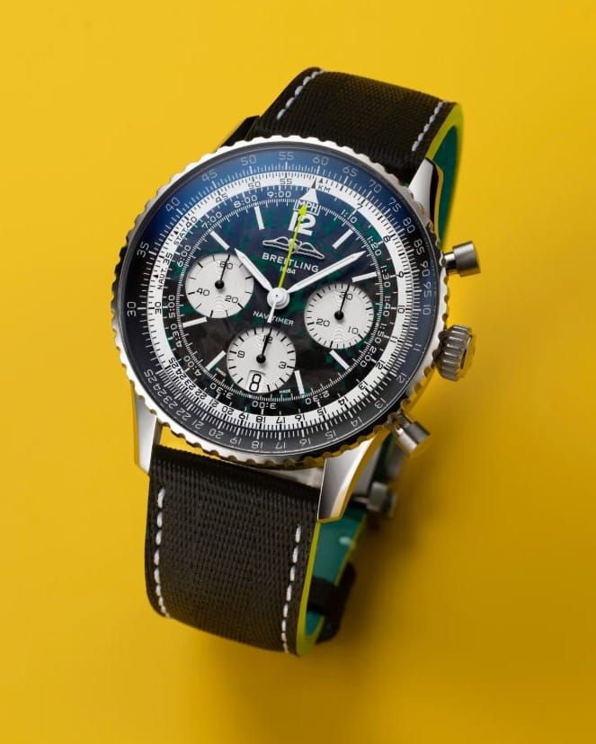 Hotlist image for Breitling Navtimer wristwatch with titanium case, black dial, and anthracite calfskin leather strap.