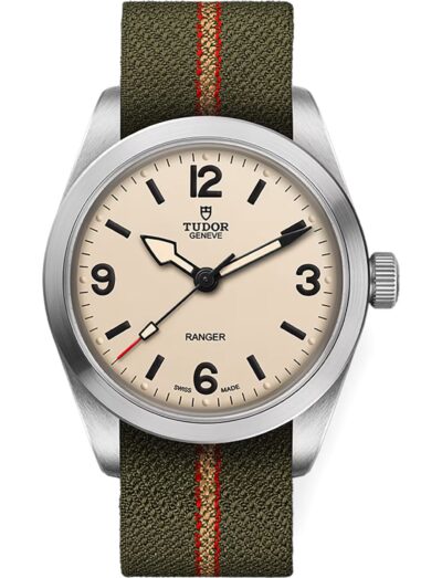 Tudor wristwatch with stainless steel case, beige dial, and green fabric bracelet with red and beige stripes.