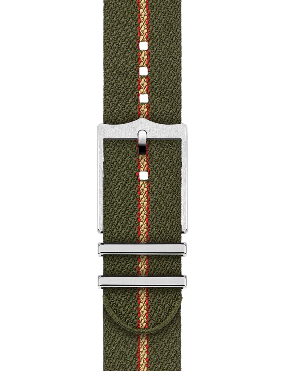Green fabric bracelet with red and beige stripes and buckle of Tudor wristwatch.