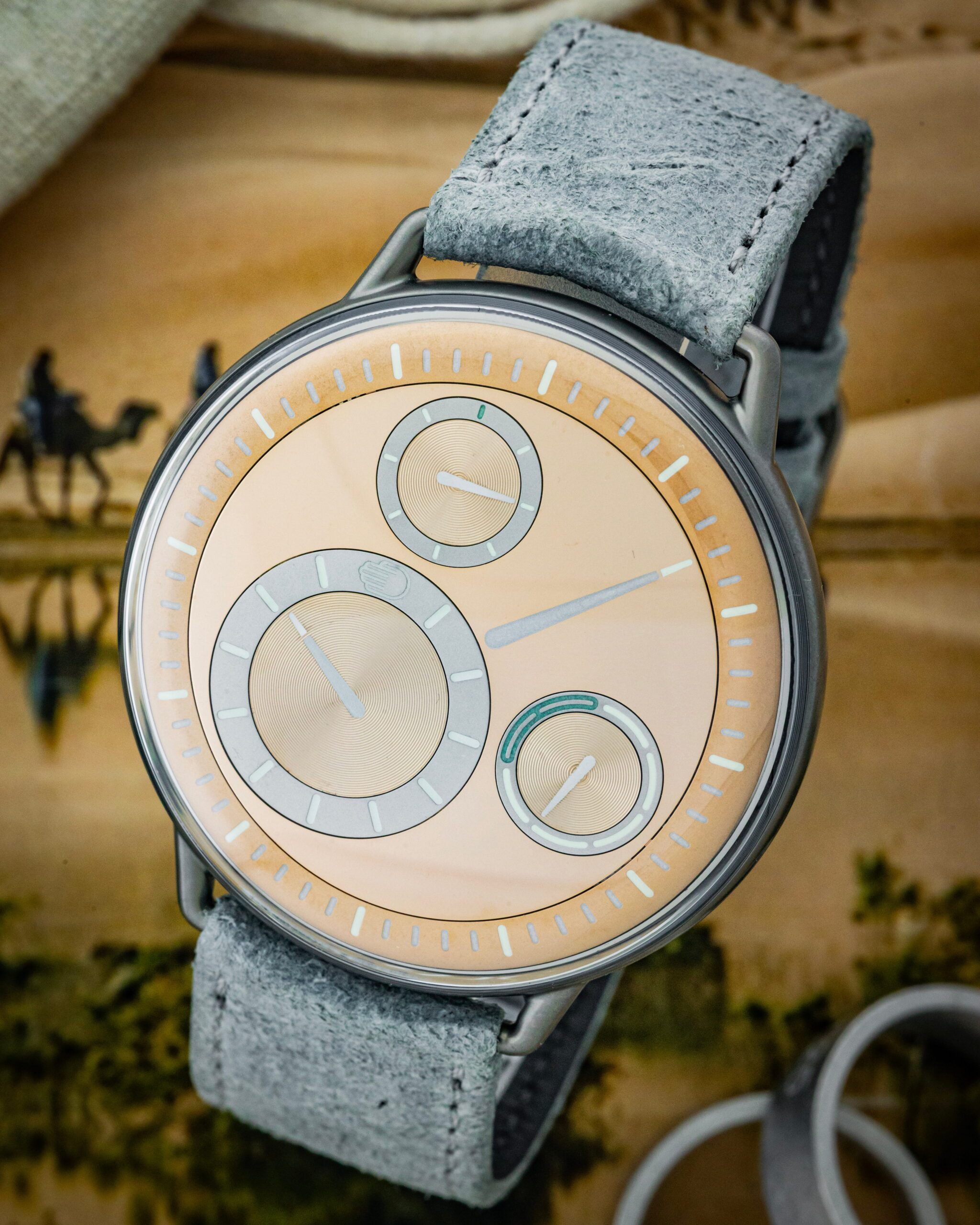 Hotlist image for Ressence wristwatch with grade 5 titanium case, silver dial, and leather strap.