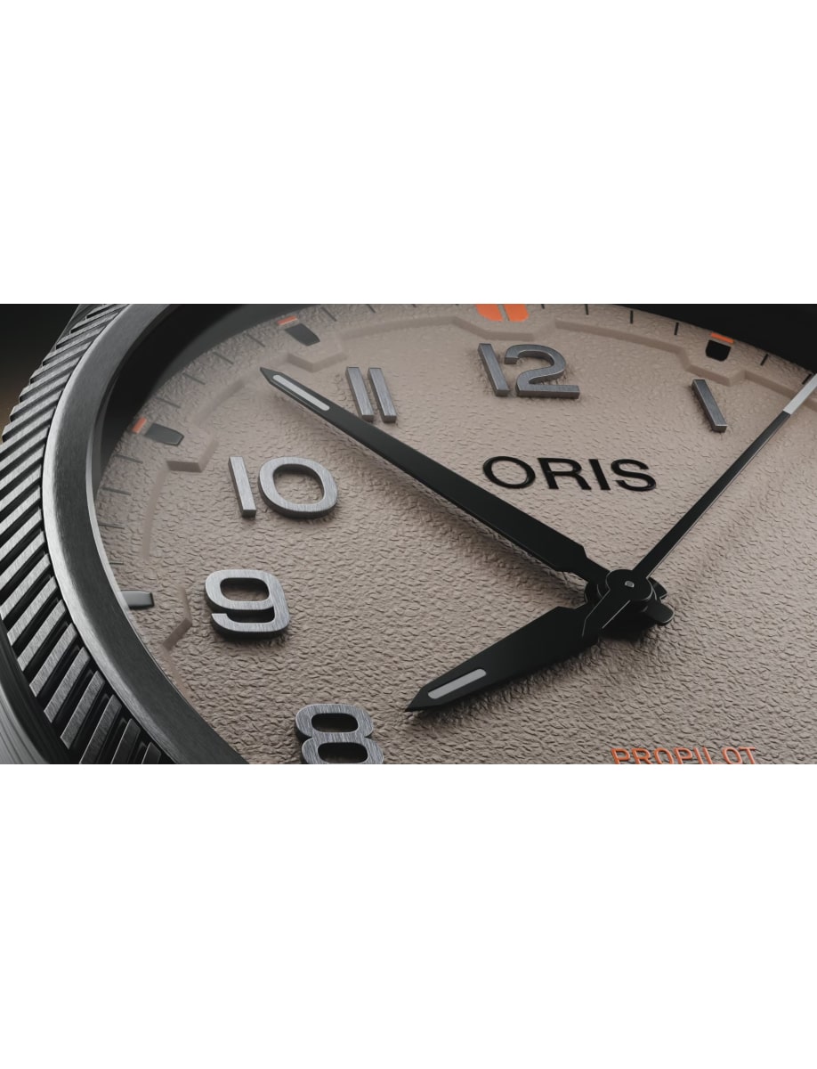 Closer view of Oris wristwatch with stainless steel case, brown dial and black rubber strap