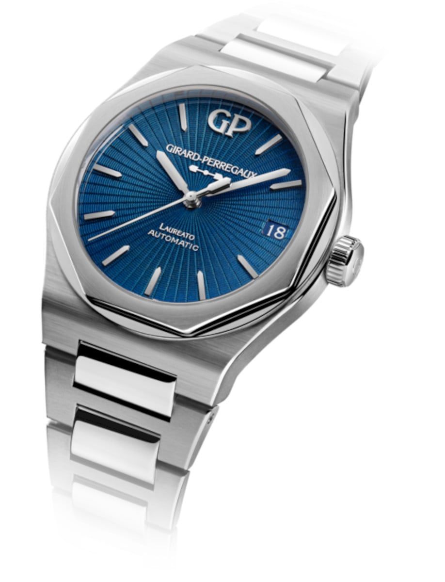 Side view of Girard-Perregaux wristwatch with stainless steel case and bracelet, blue enamel with a guilloché sunray motif dial.