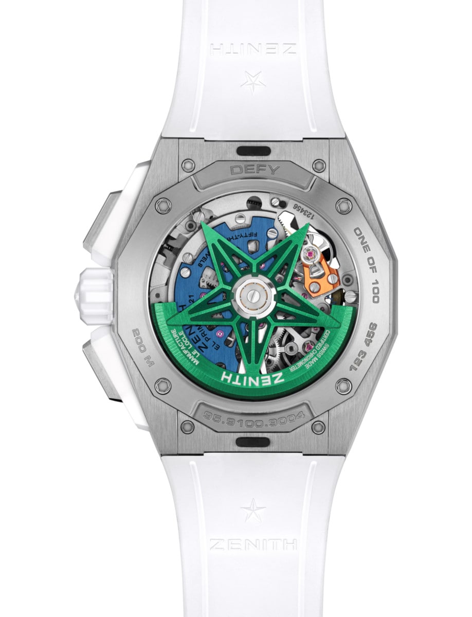 Back view of Zenith wristwatch with titanium case, open case back, and white rubber strap with folding clasp.