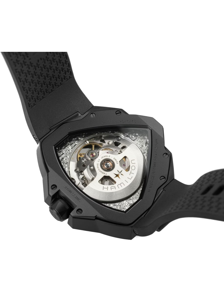 Back view of Hamilton wristwatch with PVD black stainless steel case, black rubber strap, and open case back.