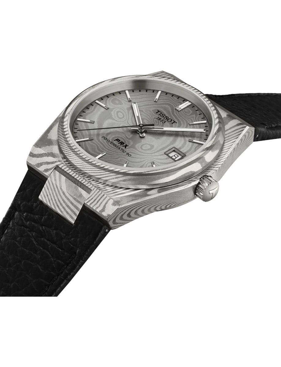 Side view of Tissot wristwatch with Marbled Damascus stainless steel case, grey dial, and black embossed cow leather strap.