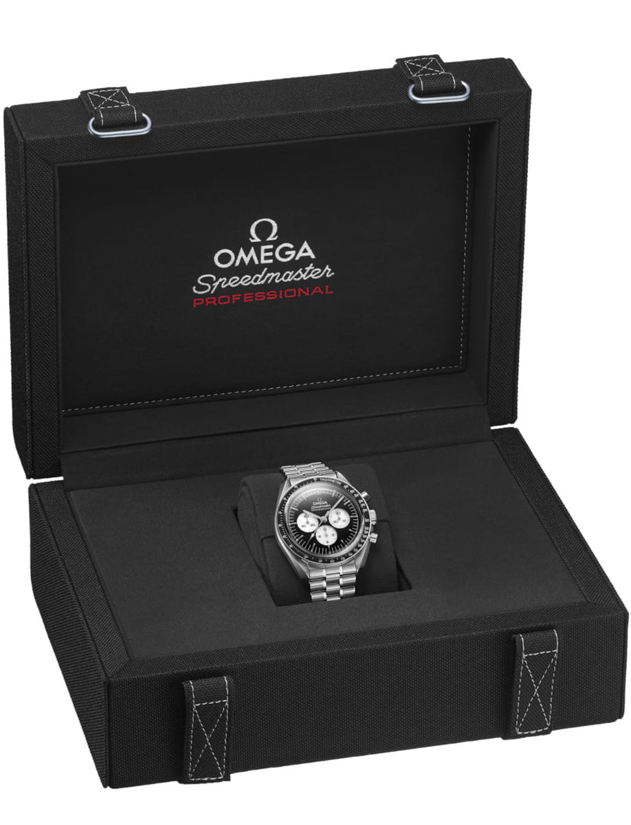 Omega Speedmaster Professional watch in an open black presentation case with logo on the lid, showcasing a stainless steel bracelet and black dial.