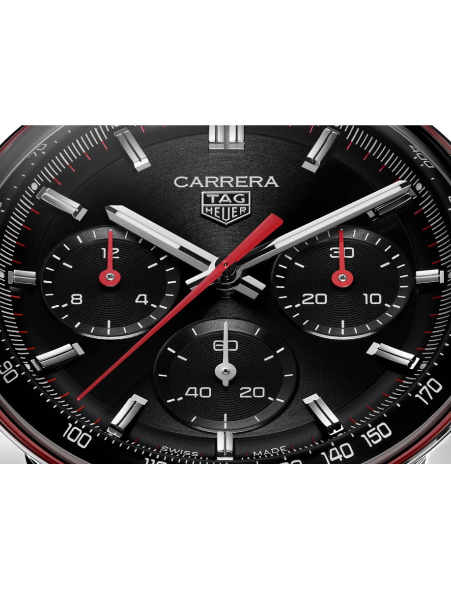 Close view of the dial of Tag Heuer wristwatch with stainless steel case and black dial.
