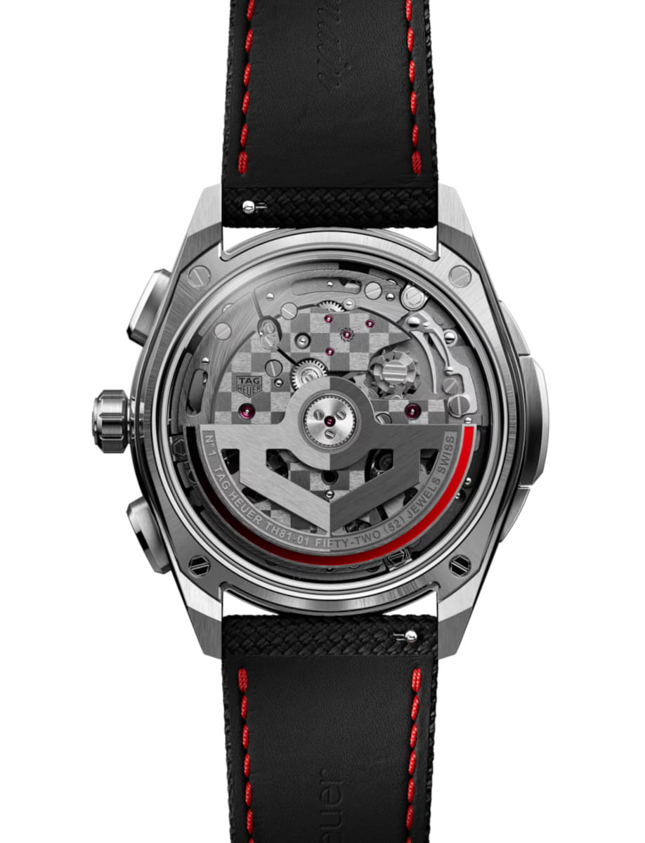 Back view of Tag Heuer wristwatch with stainless steel case, transparent dial, and black rubber and leather strap.