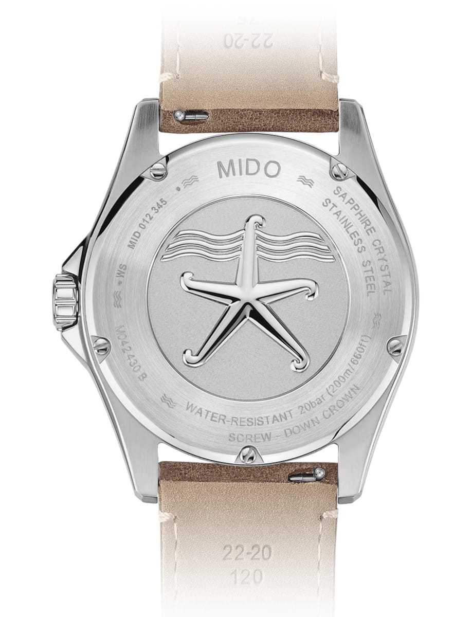 Back view of Mido wristwatch with stainless steel case, and brown leather strap.